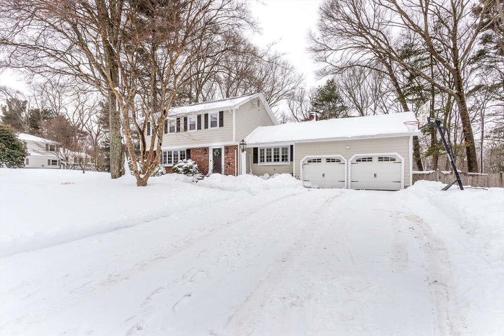 74 Cedarcrest Road Canton, MA 02021 - Photo 3 of 28 a view of a white house with a yard covered in snow