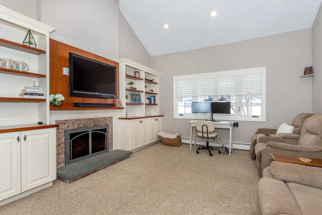 74 Cedarcrest Road Canton, MA 02021 - Photo 10 of 28 a living room with furniture fireplace and flat screen tv