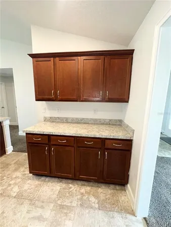 a view of sink and cabinets