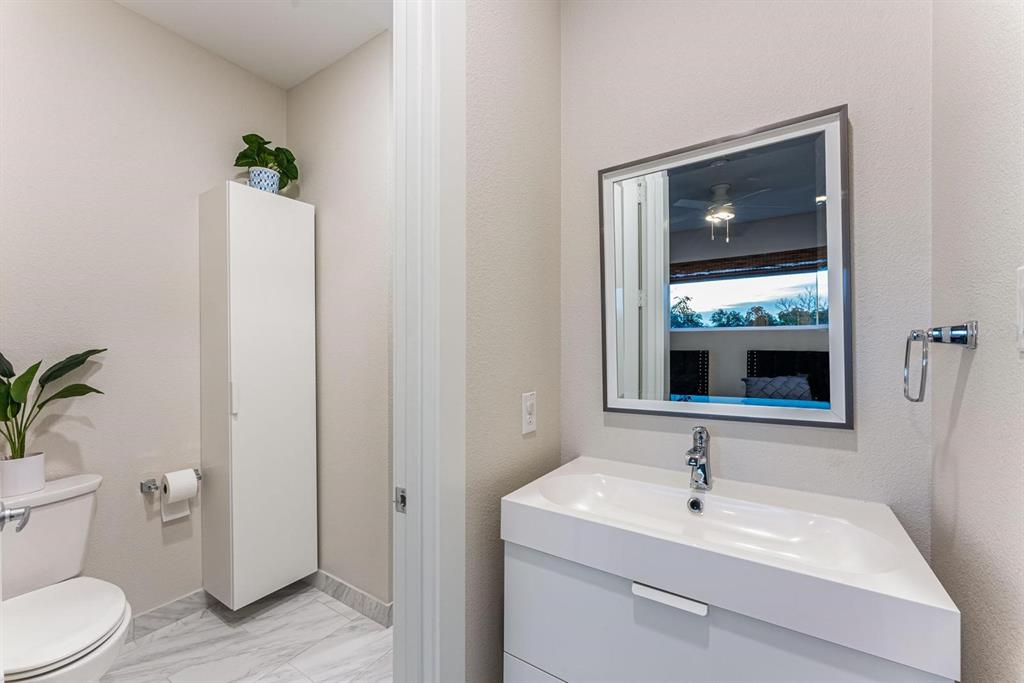 4013 Ivanhoe Lane Dallas, TX 75212 - Photo 31 of 38 Bathroom featuring vanity and toilet