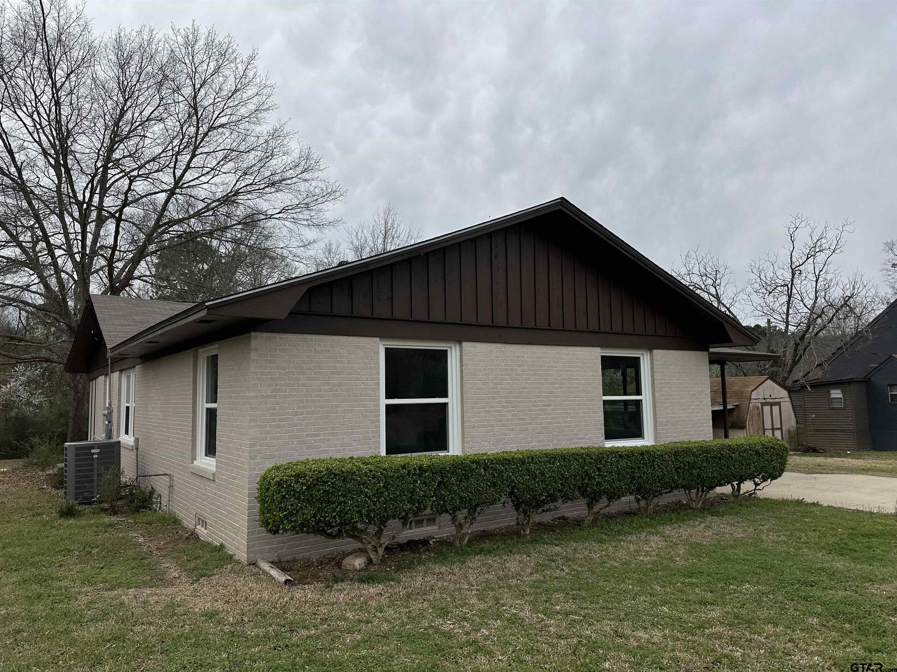 1118 East Main Street Atlanta, TX 75551 - Photo 12 of 34 a front view of a house with a yard
