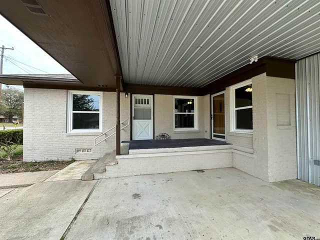 a view of a house with a large window