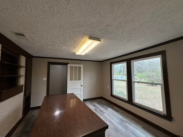 a view of hallway with wooden floor