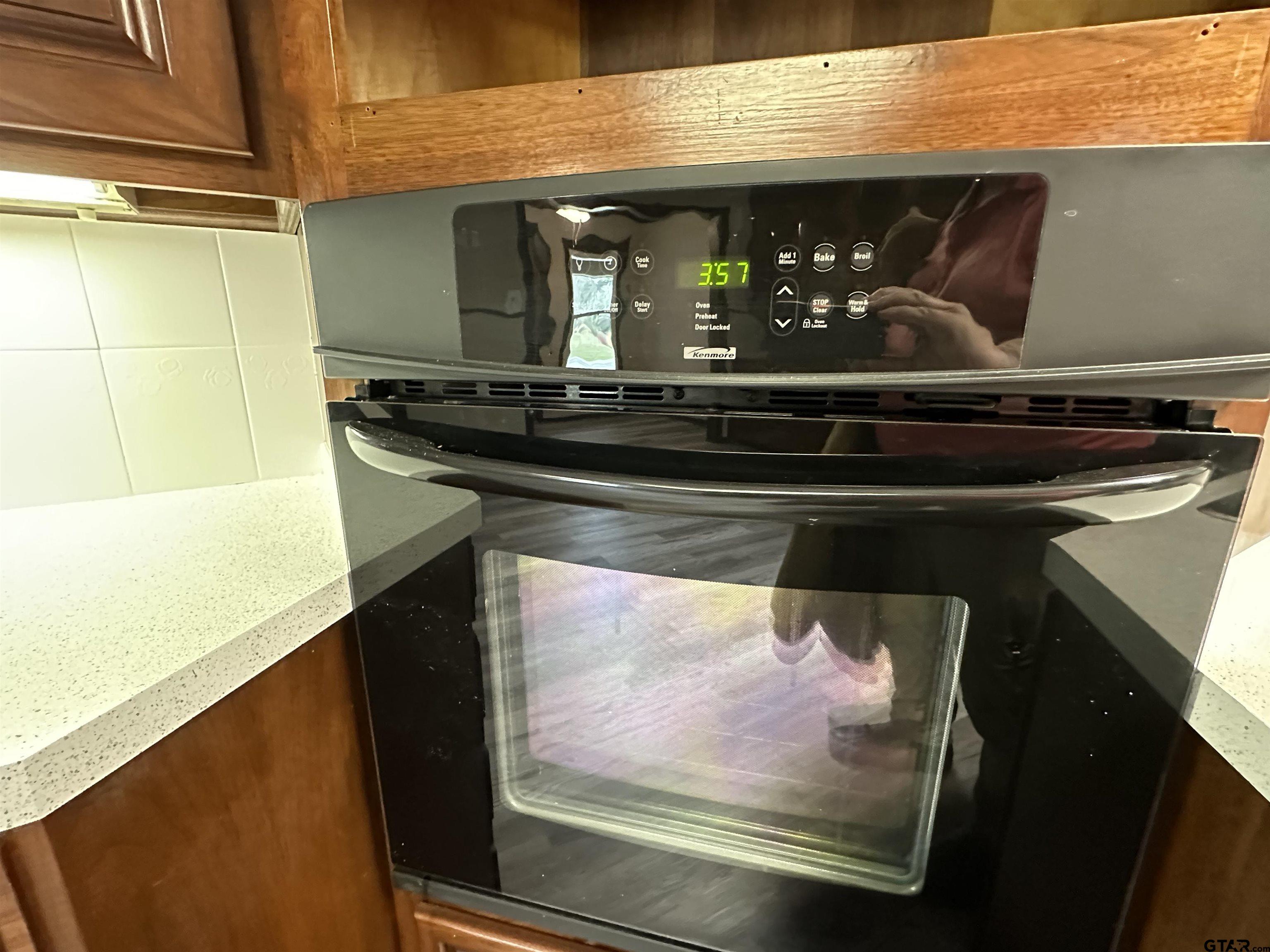 1118 East Main Street Atlanta, TX 75551 - Photo 32 of 34 a bathroom with a sink and a mirror