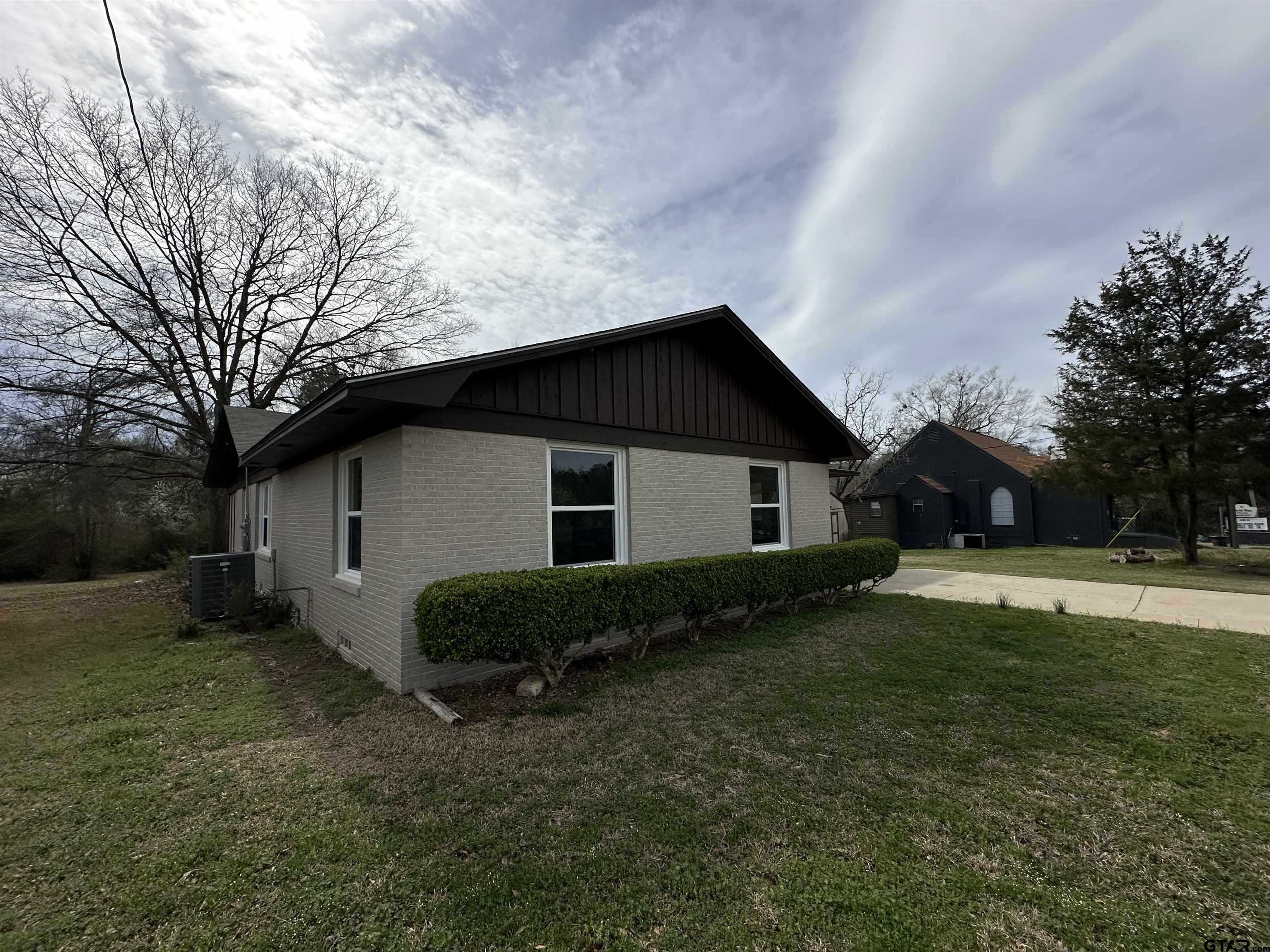1118 East Main Street Atlanta, TX 75551 - Photo 10 of 34 a view of a house with a yard