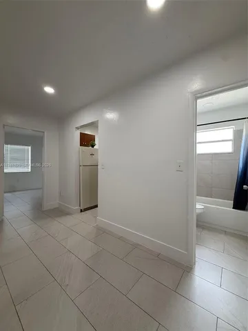 a view of an empty room and a windows