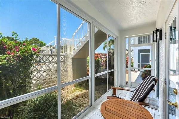 a view of balcony with furniture