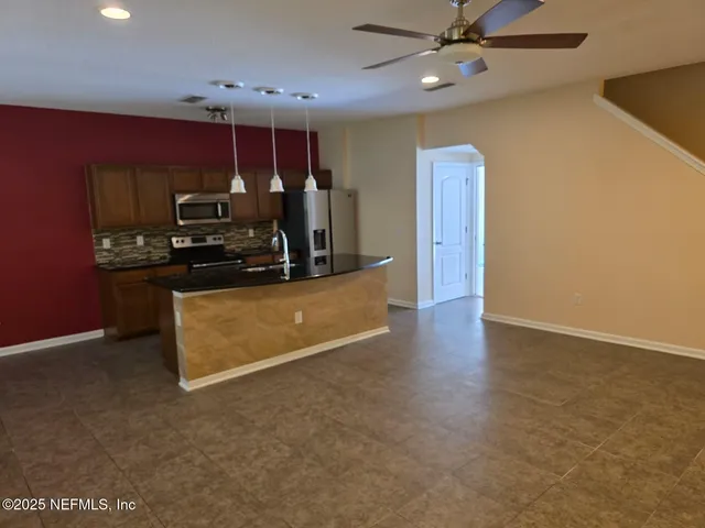 a view of a kitchen with a sink