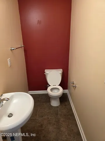 a bathroom with a toilet and a sink