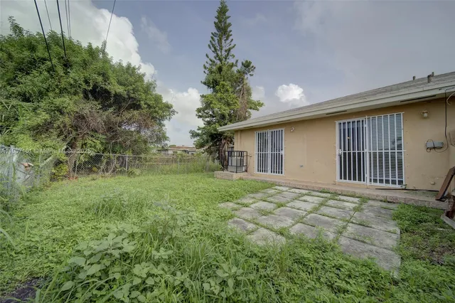 a backyard of a house with lots of green space