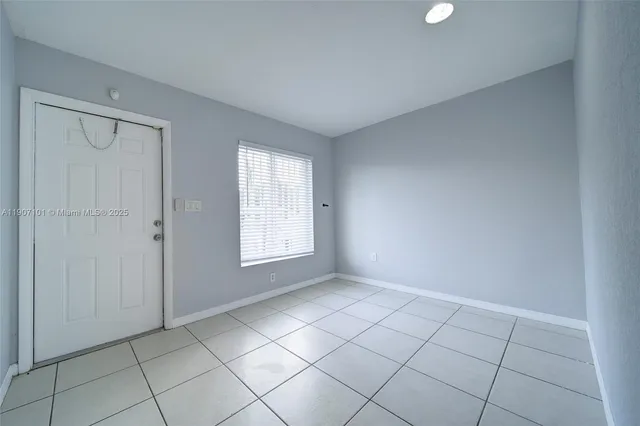 a view of an empty room and window