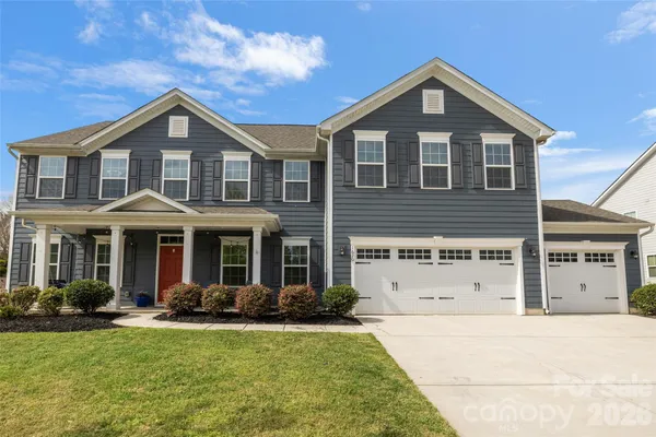 a front view of a house with swimming pool