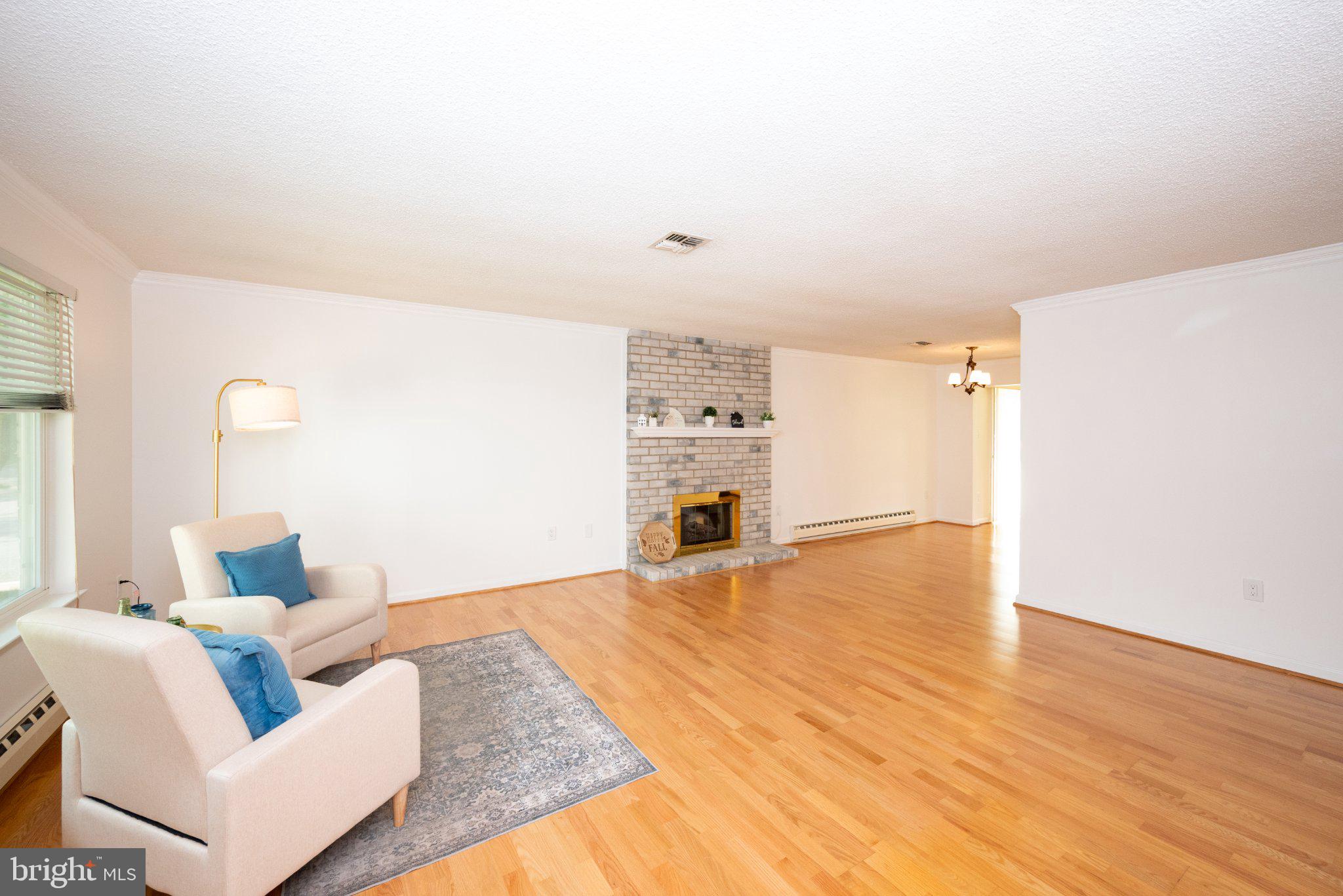 Spacious Living Room with Fireplace.