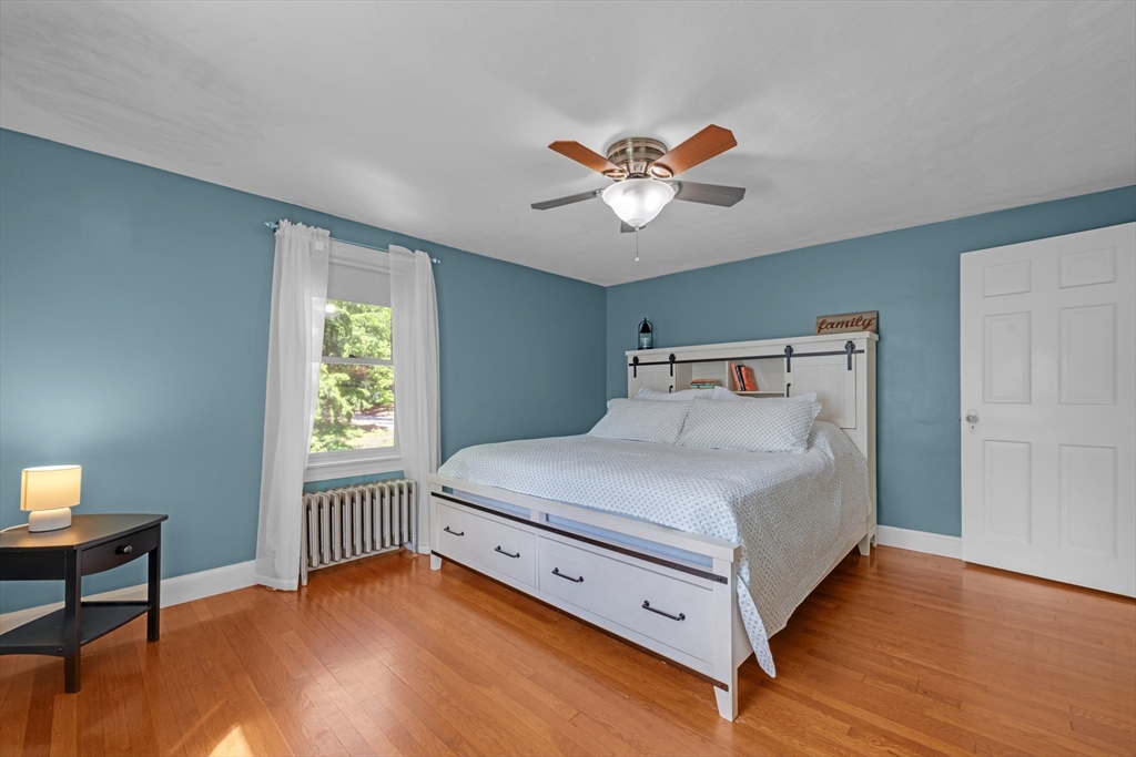 71 Morningside Road Worcester, MA 01602 - Photo 21 of 42 a bedroom with a bed and a chandelier