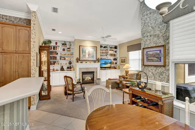 a living room with furniture a fireplace and a table