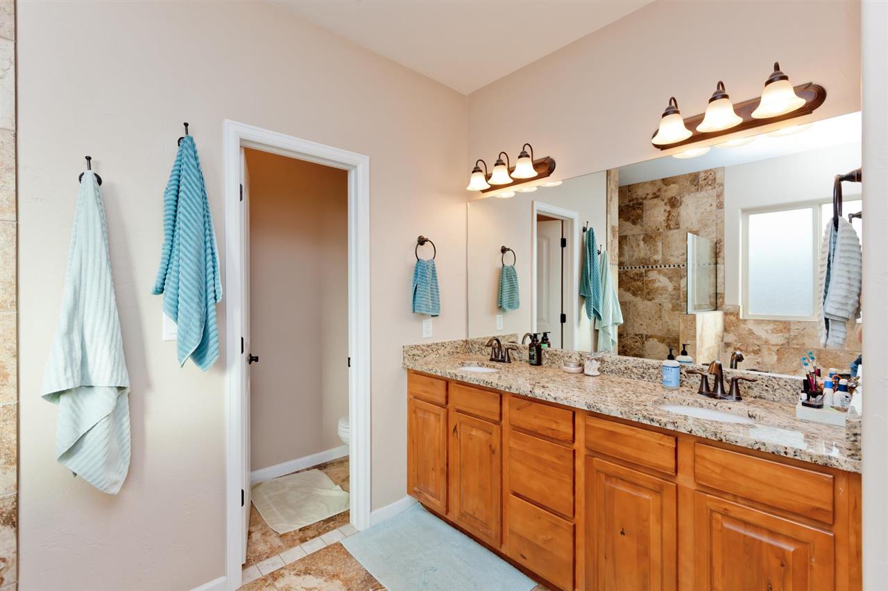 777 Foxtail Road Grand Junction, CO 81505 - Photo 10 of 26 a bathroom with a double vanity sink mirror and shower