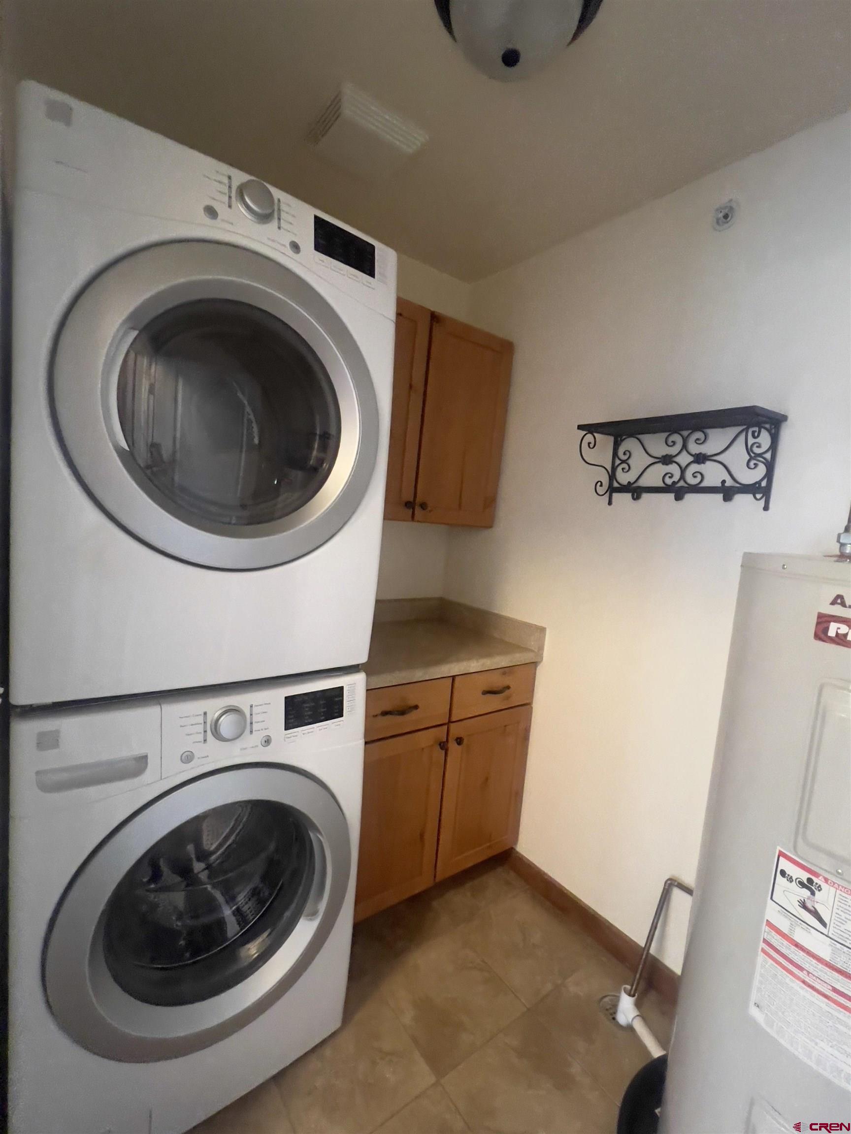 540 Redcliff Circle, Unit E 203 Ridgway, CO 81432 - Photo 10 of 36 a utility room with dryer and washer