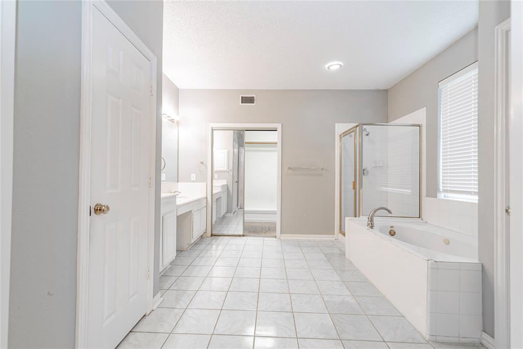 112 Midcrest Drive Irving, TX 75063 - Photo 20 of 37 a bathroom with a tub shower and sink