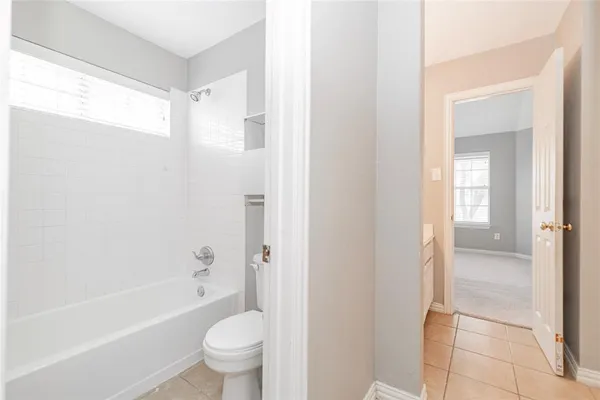 a bathroom with a bathtub toilet and sink