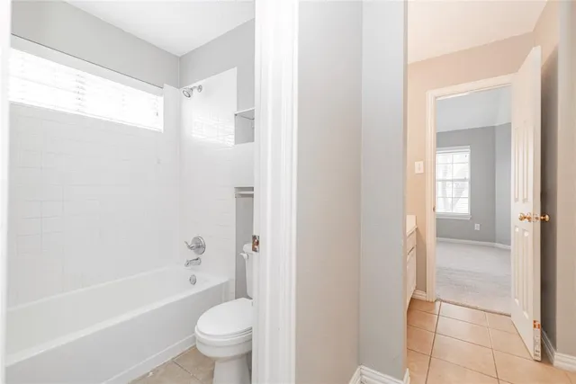 a bathroom with a bathtub toilet and sink