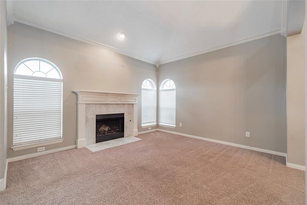 112 Midcrest Drive Irving, TX 75063 - Photo 5 of 37 a view of a livingroom with a fireplace and window