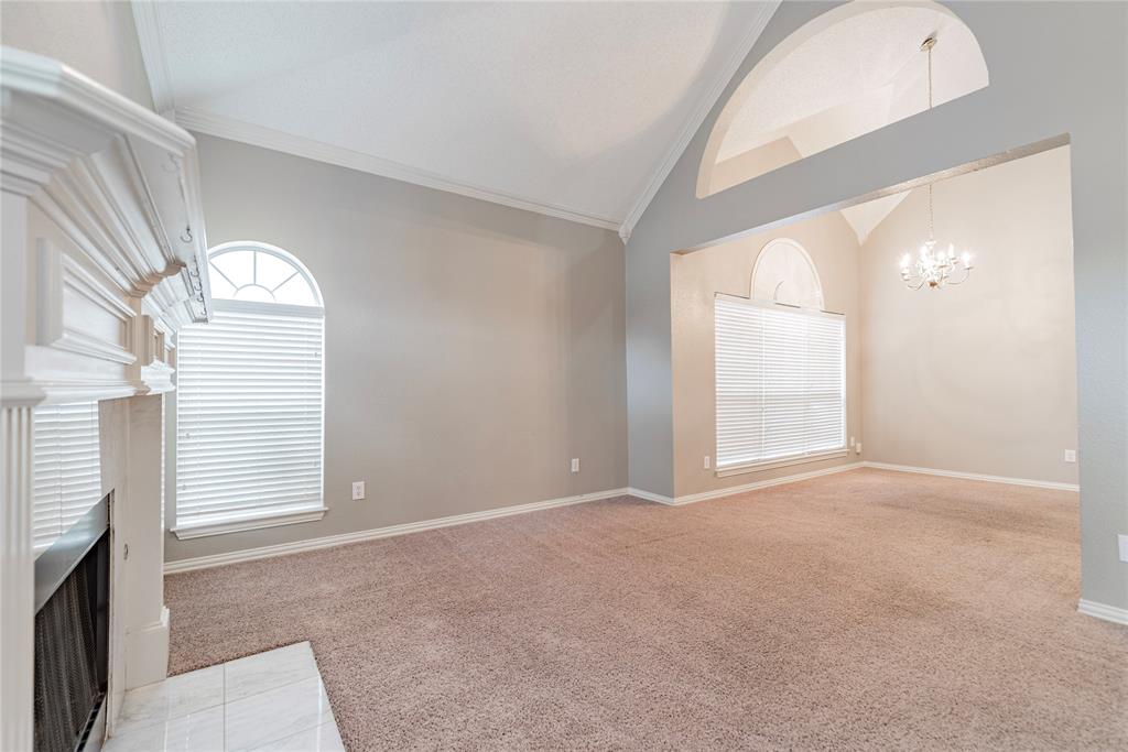 112 Midcrest Drive Irving, TX 75063 - Photo 6 of 37 an empty room with windows
