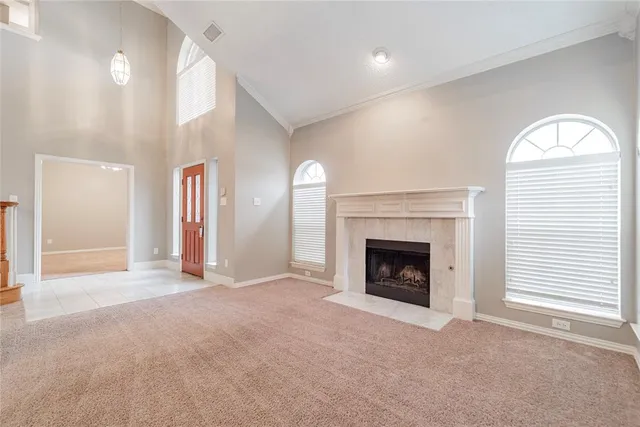 a view of a livingroom with an empty space and a fireplace