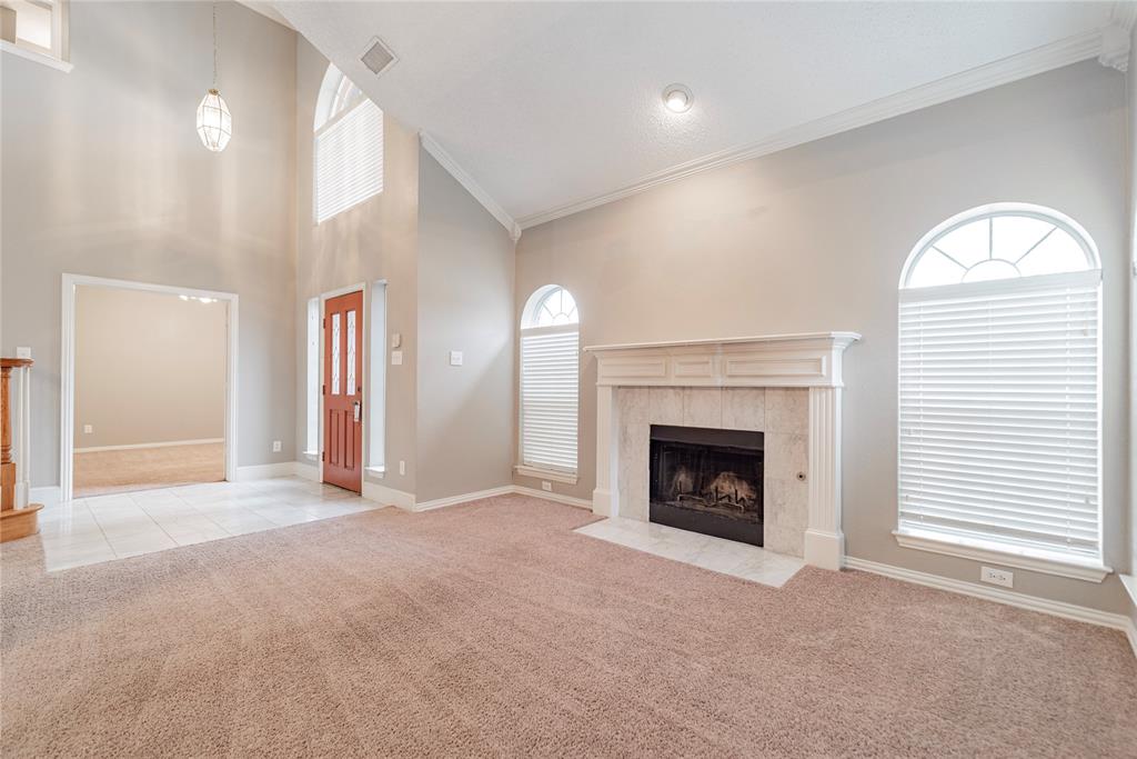 112 Midcrest Drive Irving, TX 75063 - Photo 7 of 37 a view of a livingroom with an empty space and a fireplace