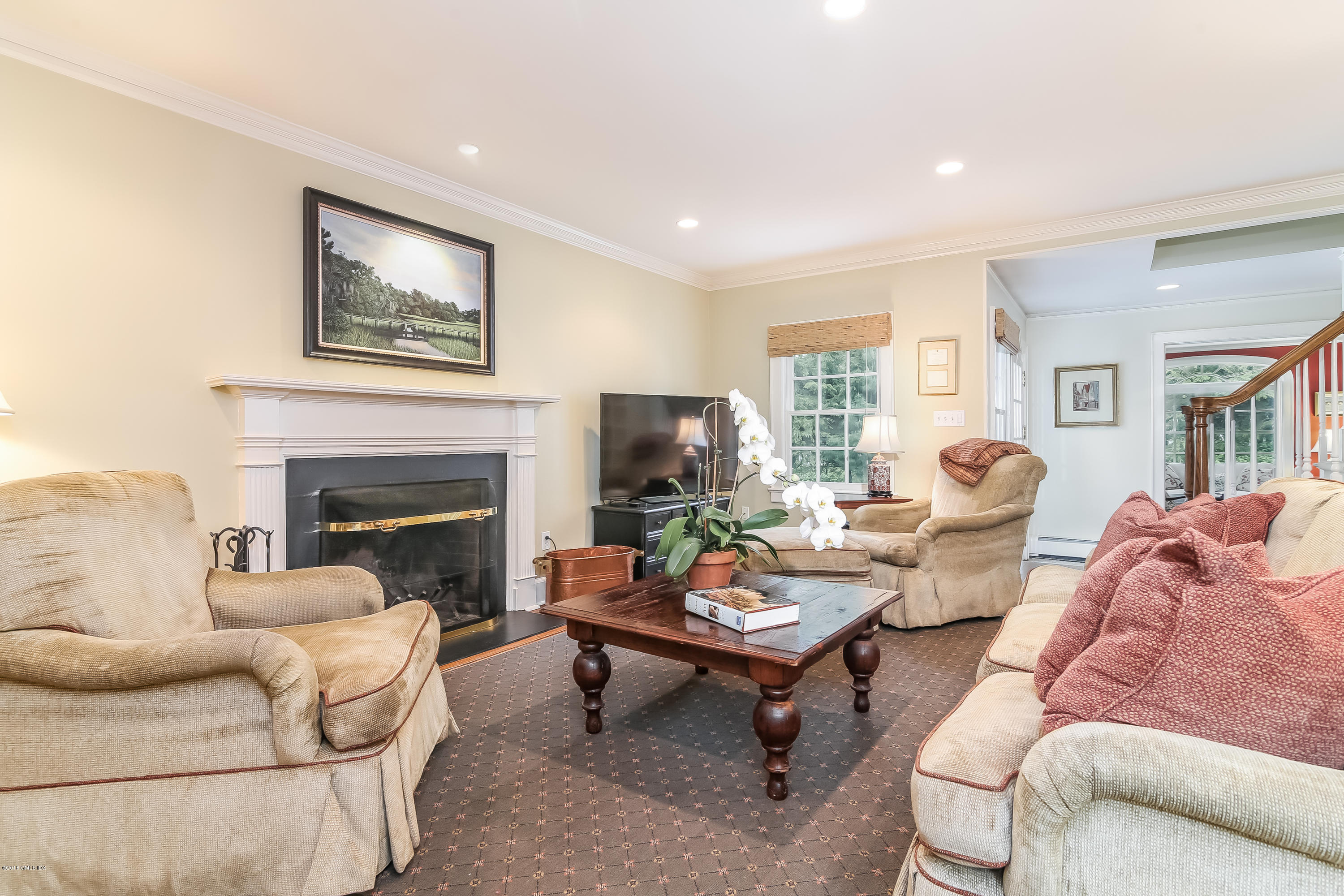 219 Riverside Avenue Riverside, CT 06878 - Photo 12 of 40 a living room with furniture couches and a fireplace