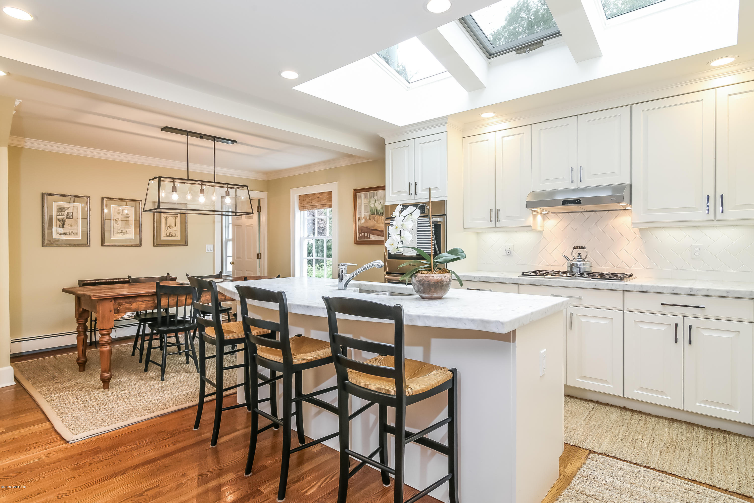 219 Riverside Avenue Riverside, CT 06878 - Photo 16 of 40 a kitchen with cabinets table and chairs