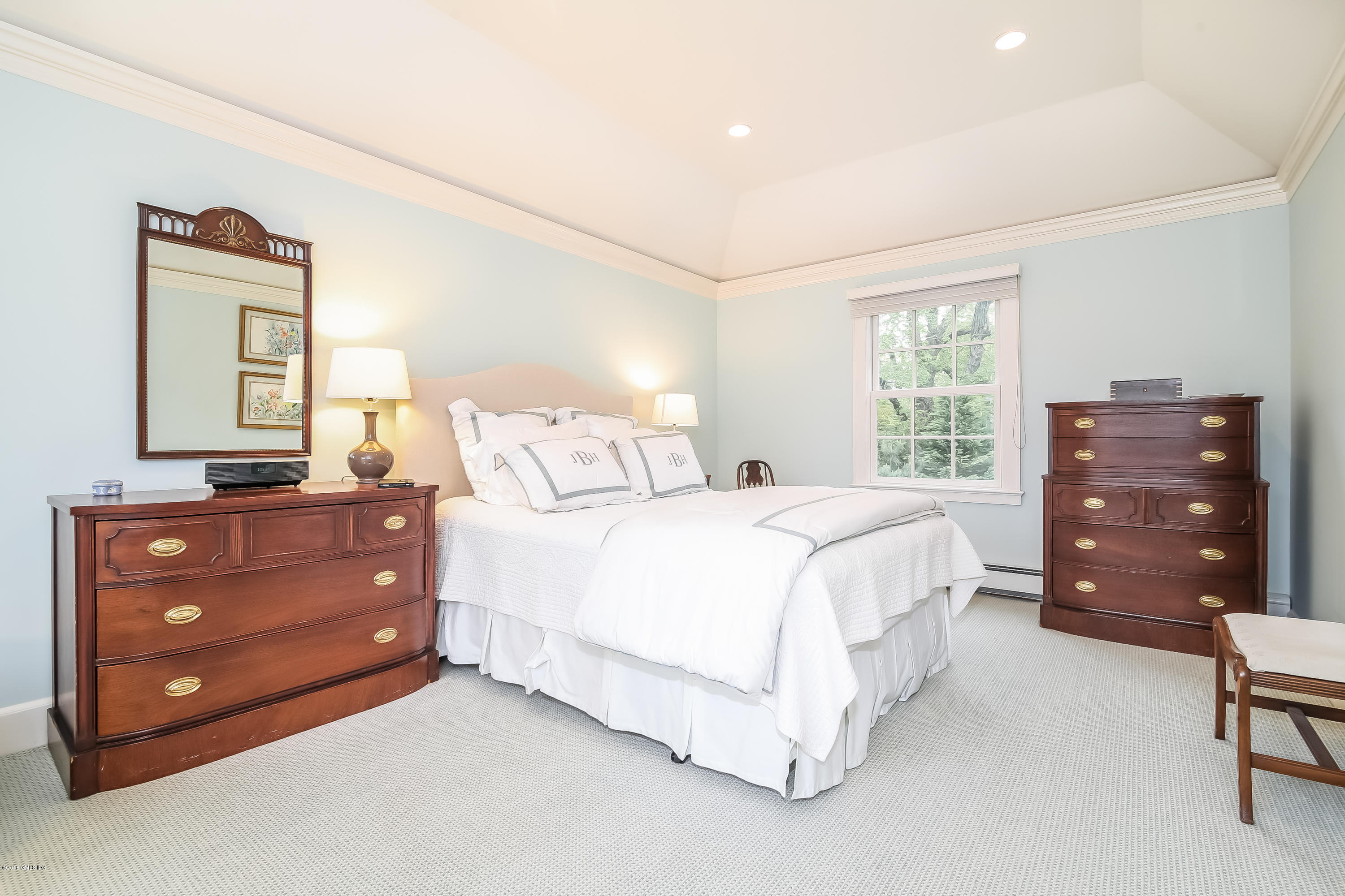 219 Riverside Avenue Riverside, CT 06878 - Photo 23 of 40 a bedroom with a bed and a dresser