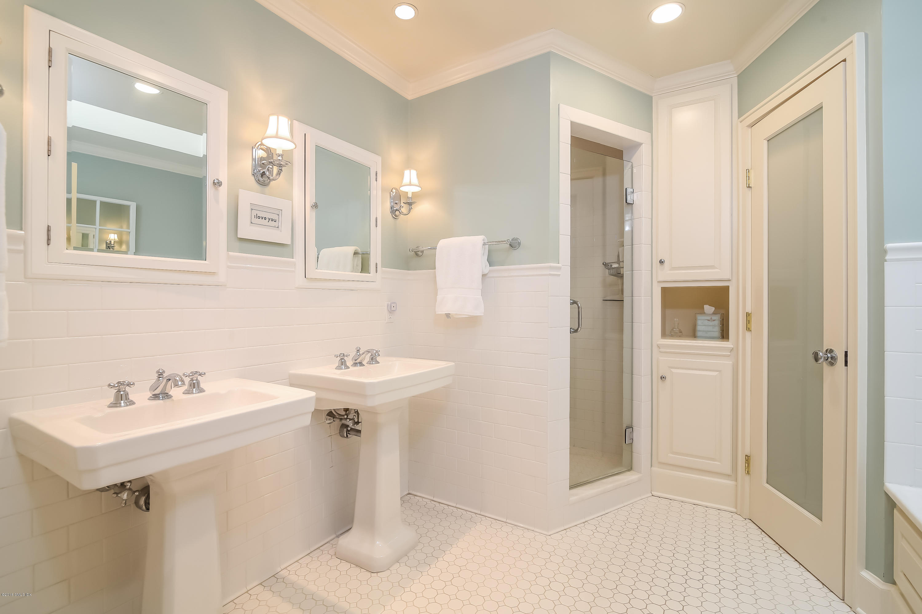 219 Riverside Avenue Riverside, CT 06878 - Photo 26 of 40 a bathroom with a sink a mirror and a toilet