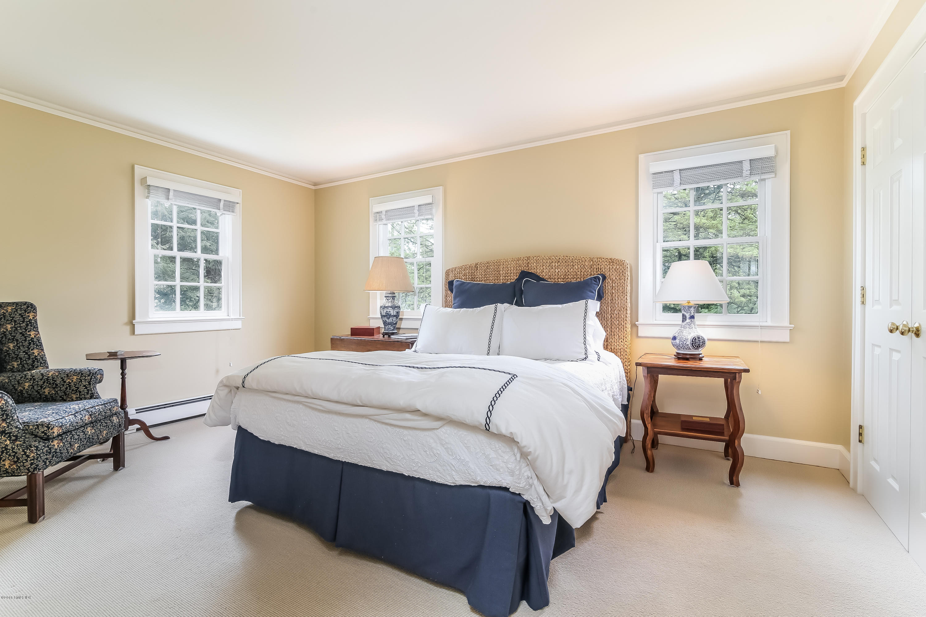 219 Riverside Avenue Riverside, CT 06878 - Photo 28 of 40 a bedroom with a bed and a couch