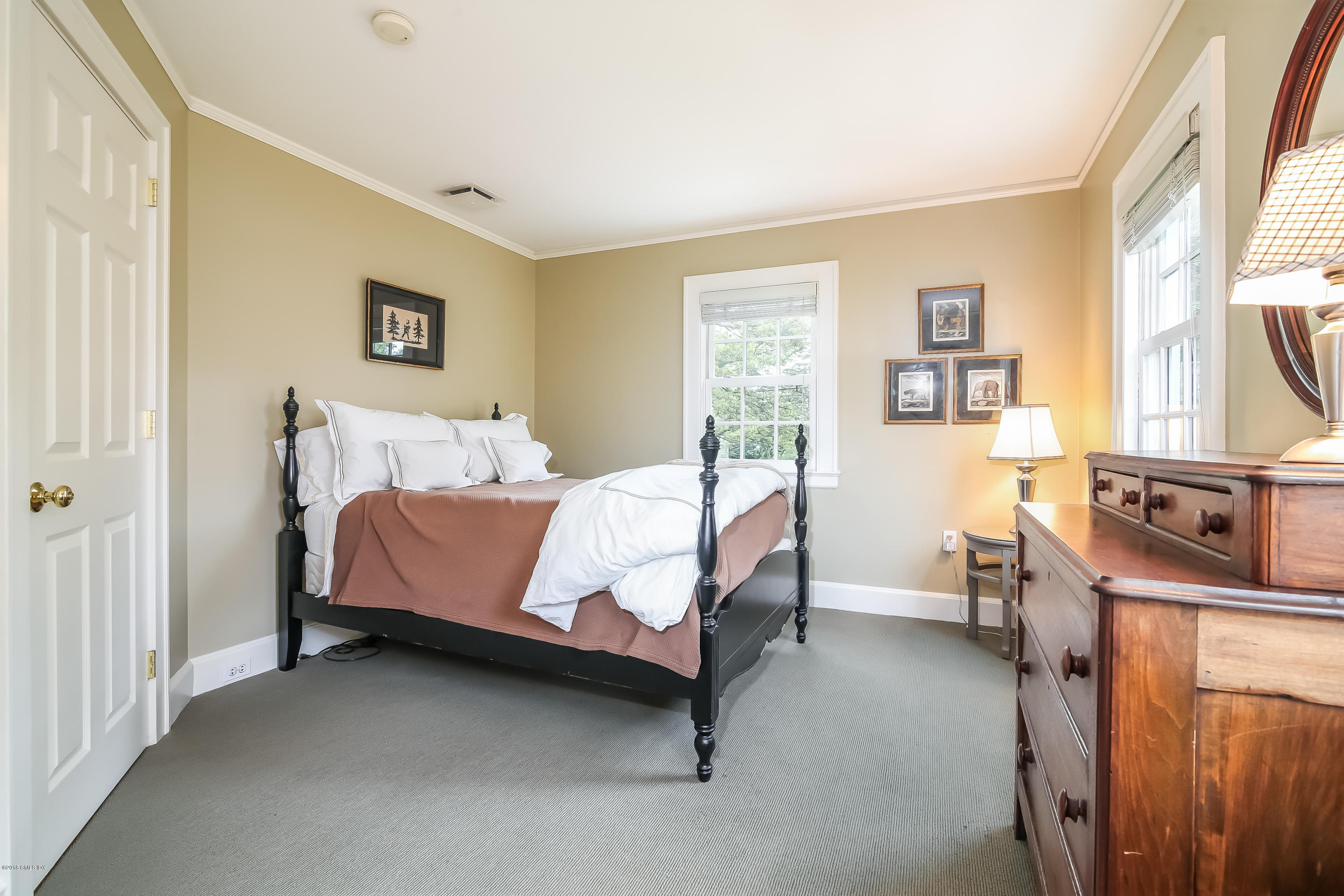 219 Riverside Avenue Riverside, CT 06878 - Photo 30 of 40 a bedroom with a bed chair and window