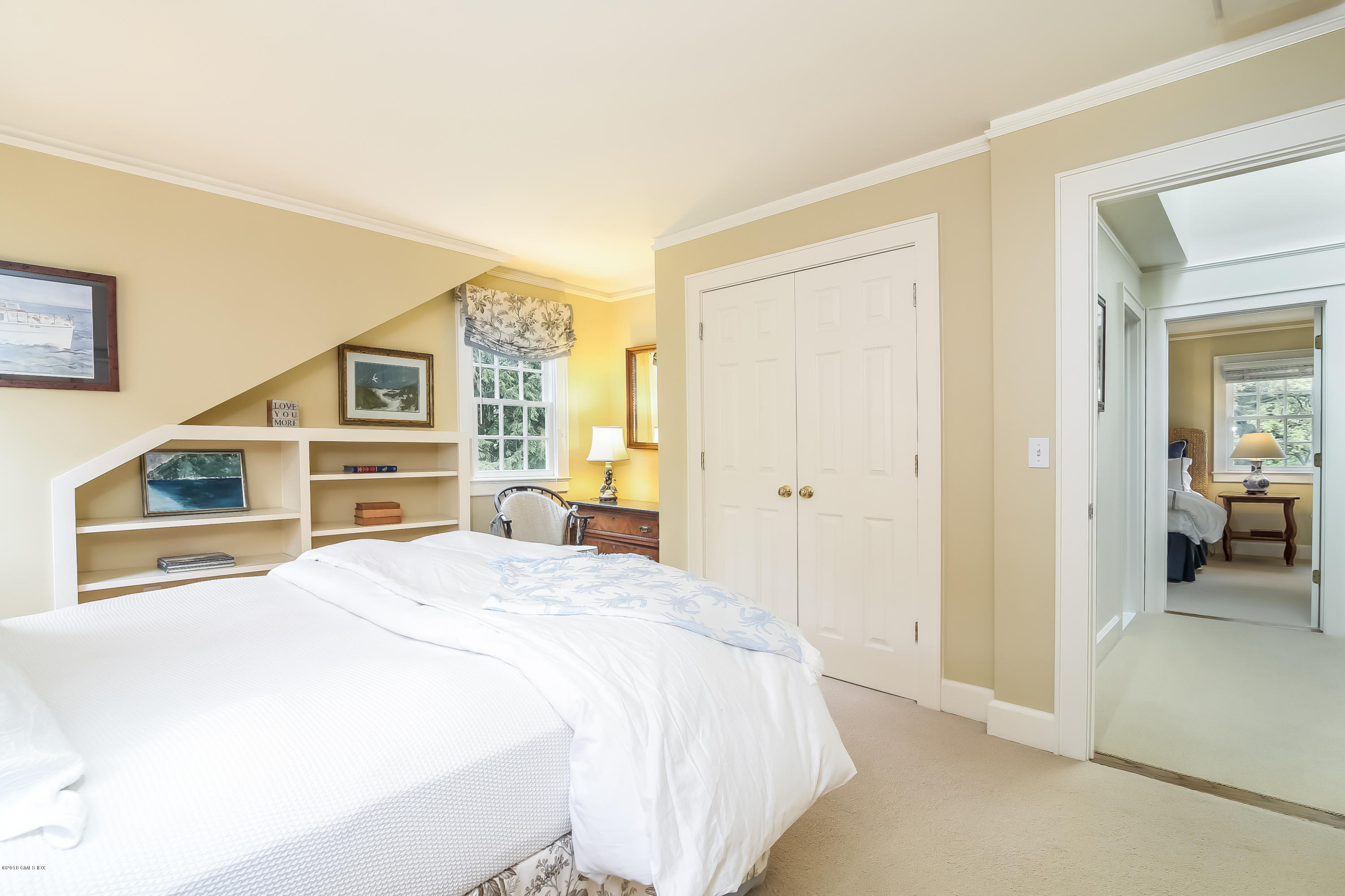 219 Riverside Avenue Riverside, CT 06878 - Photo 31 of 40 a bedroom with a bed and a large mirror on the dresser