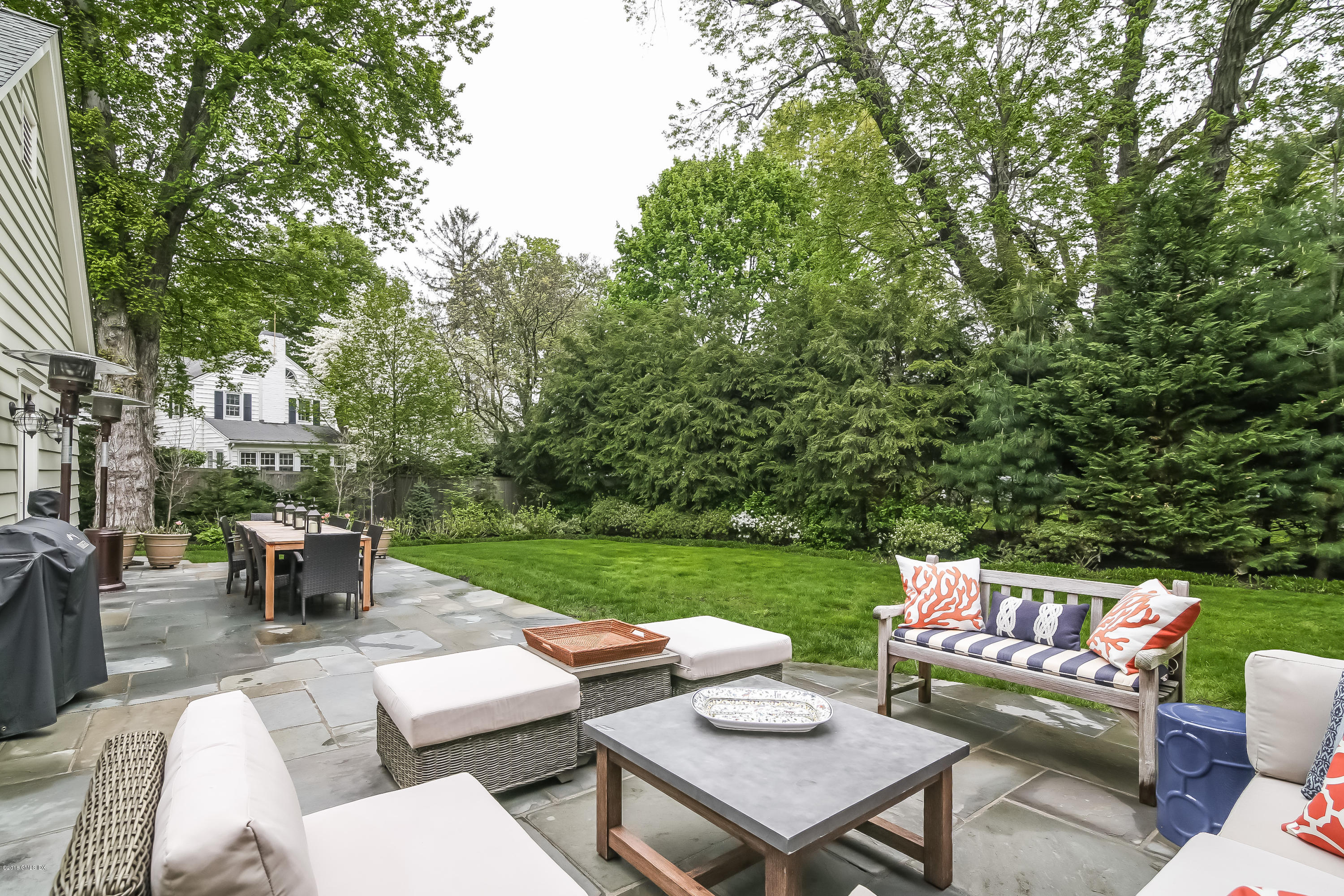 219 Riverside Avenue Riverside, CT 06878 - Photo 36 of 40 a view of a patio with couches and a table and chairs with garden view