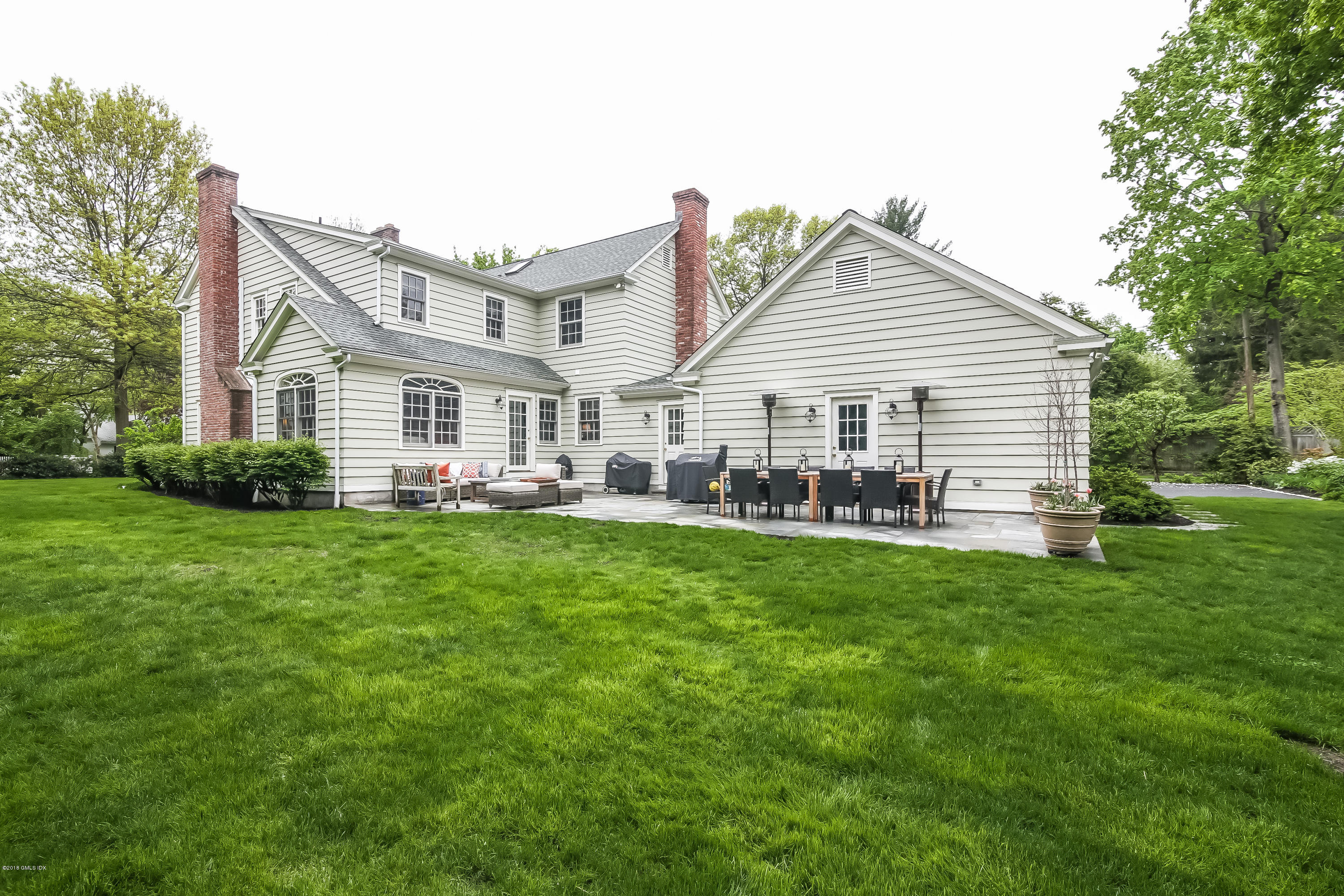 219 Riverside Avenue Riverside, CT 06878 - Photo 37 of 40 a front view of house with yard and green space