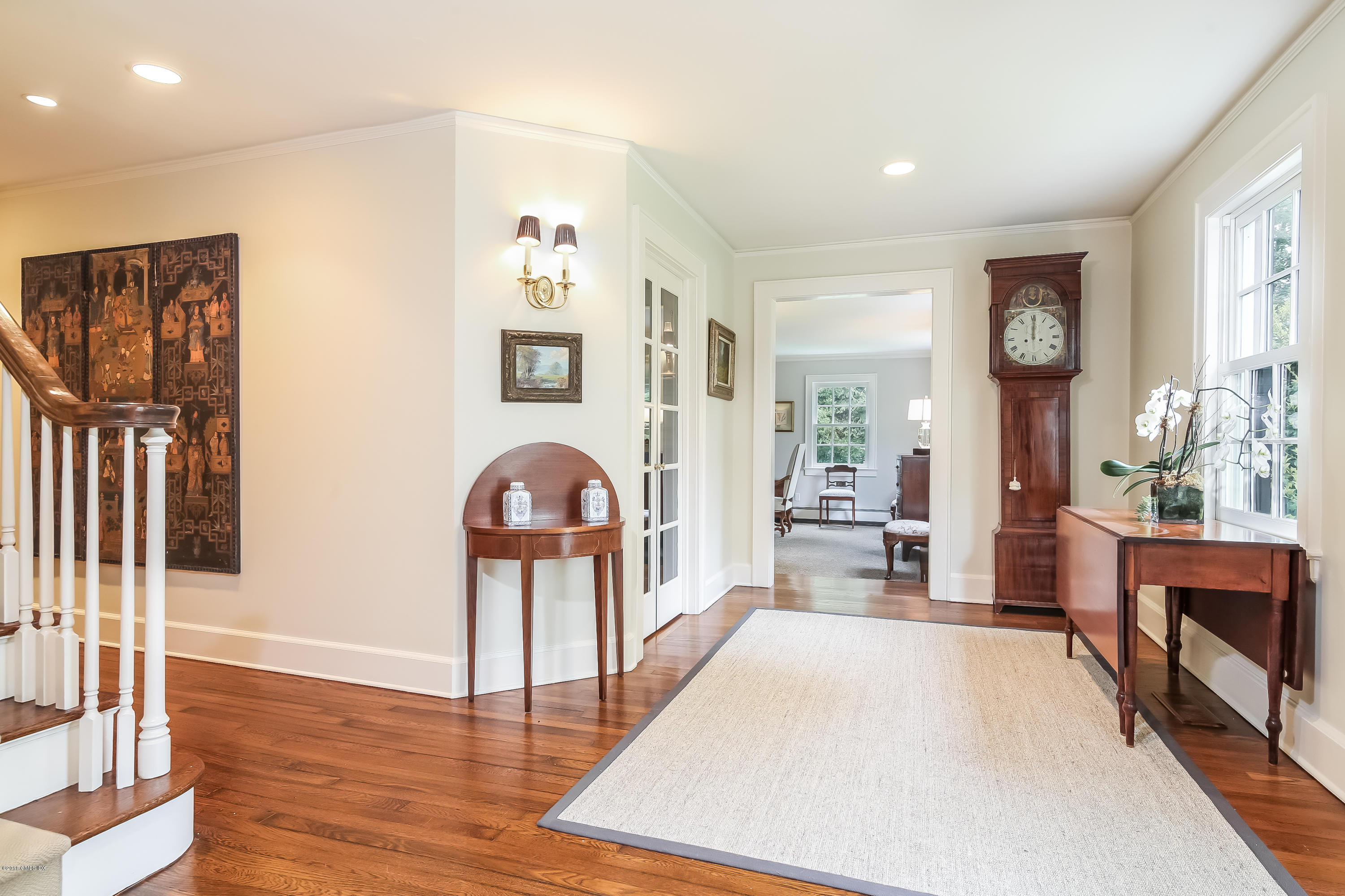 219 Riverside Avenue Riverside, CT 06878 - Photo 4 of 40 a bedroom with furniture and a wooden floor
