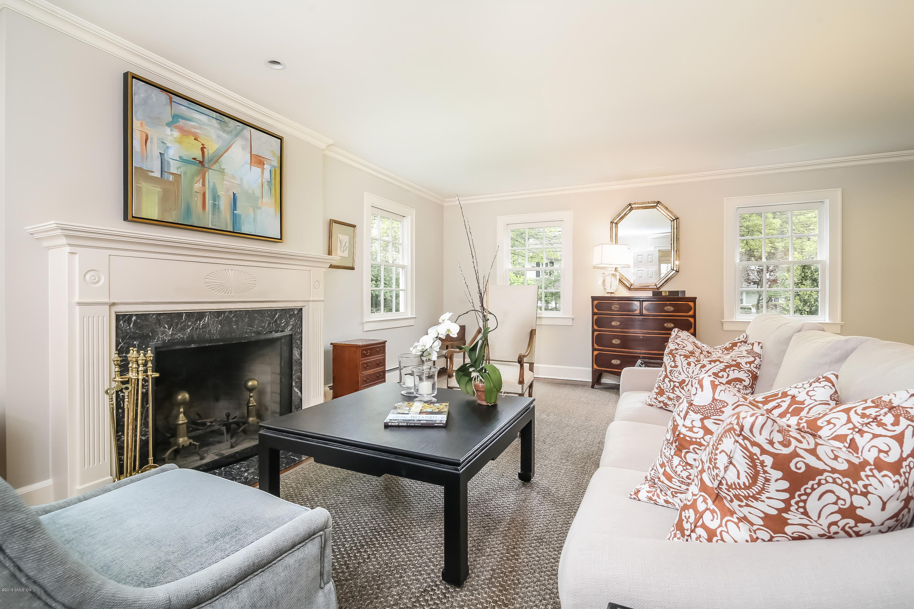 219 Riverside Avenue Riverside, CT 06878 - Photo 7 of 40 a living room with furniture and a fireplace