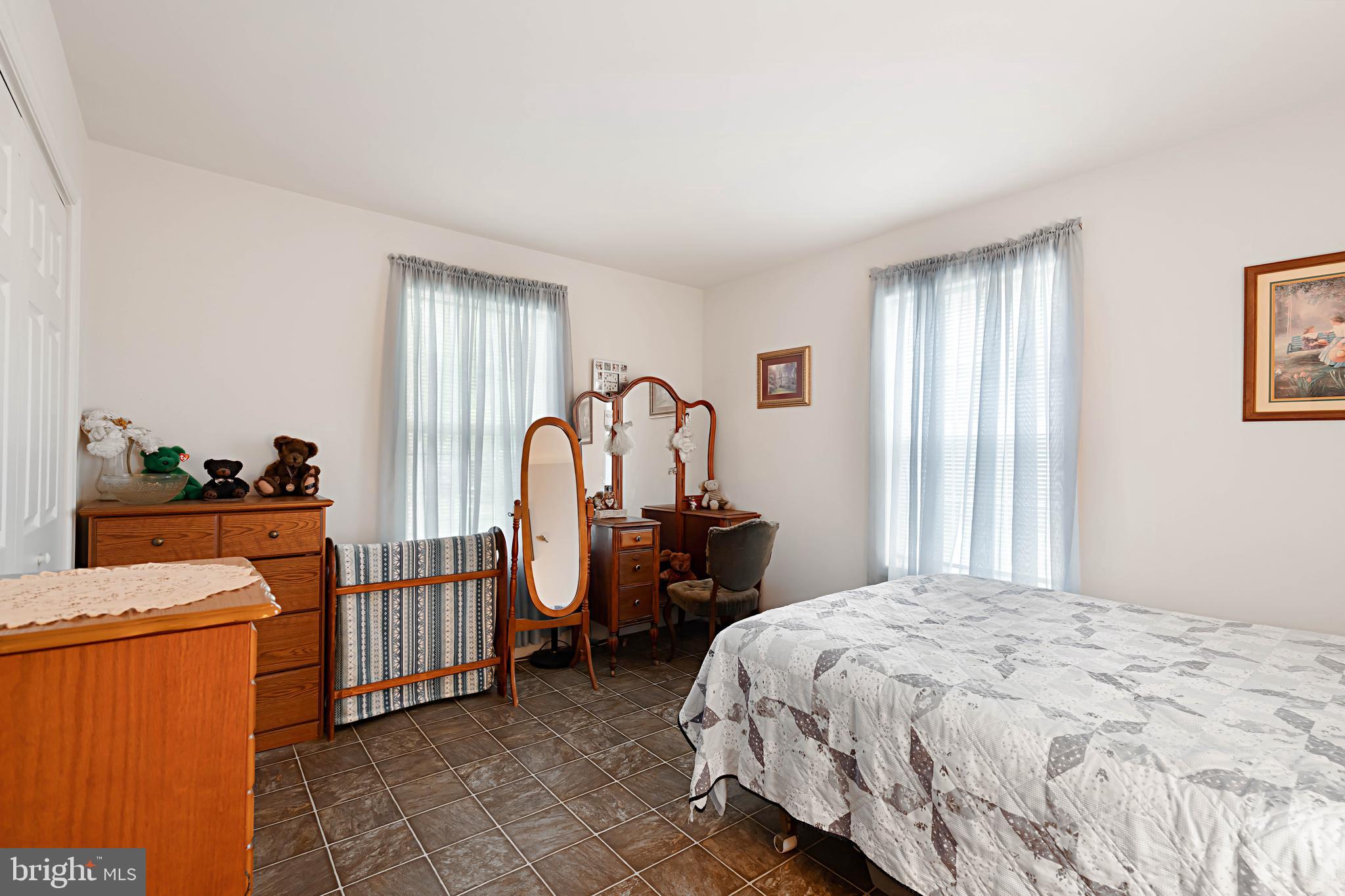 315 Beech Road Millville, NJ 08332 - Photo 17 of 21 a bedroom with a bed and a large window