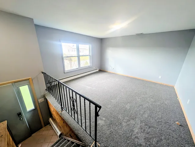 a view of a hallway with windows