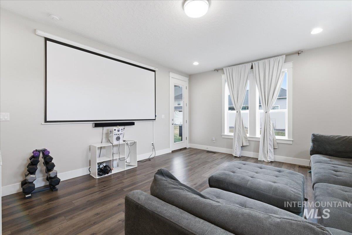 5154 South Twilight Mist Way Meridian, ID 83642 - Photo 30 of 47 Home theater with dark wood-style floors and recessed lighting