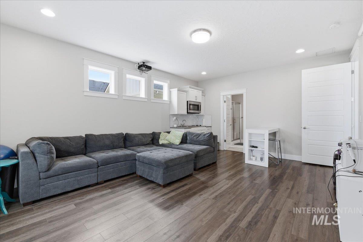 5154 South Twilight Mist Way Meridian, ID 83642 - Photo 31 of 47 Living area with dark wood-style flooring and recessed lighting