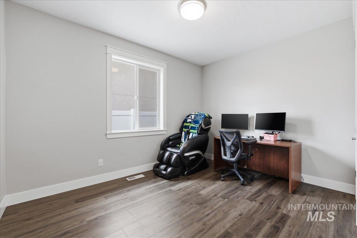 5154 South Twilight Mist Way Meridian, ID 83642 - Photo 34 of 47 Office featuring dark wood-style floors and baseboards