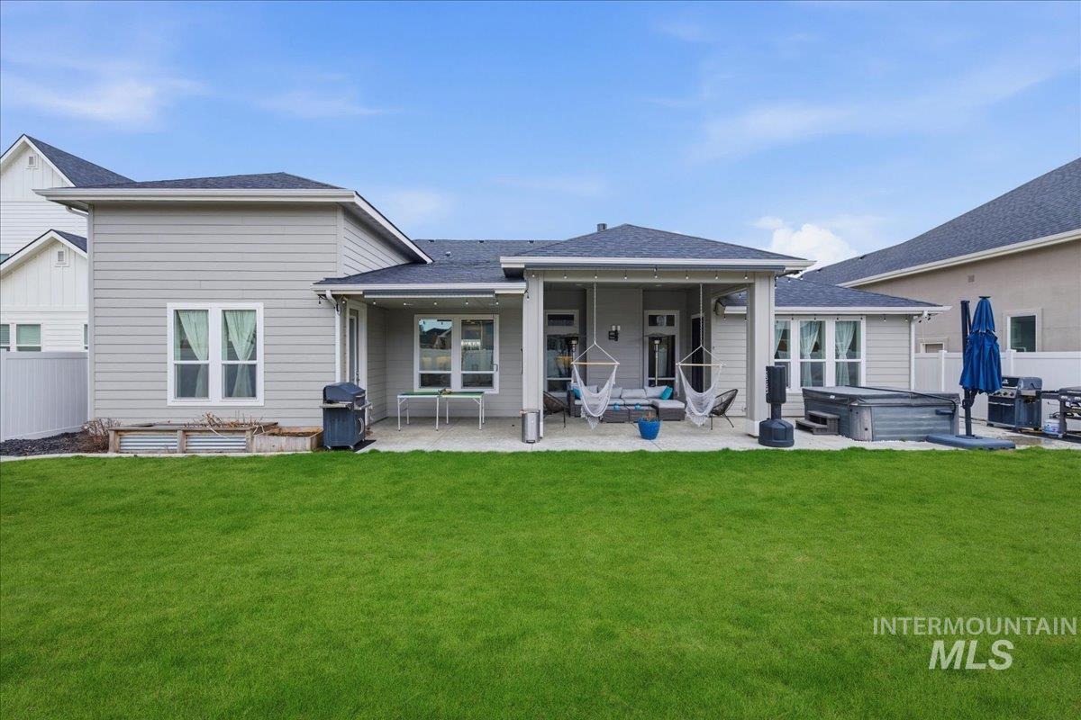 5154 South Twilight Mist Way Meridian, ID 83642 - Photo 38 of 47 Rear view of property featuring a patio and a shingled roof