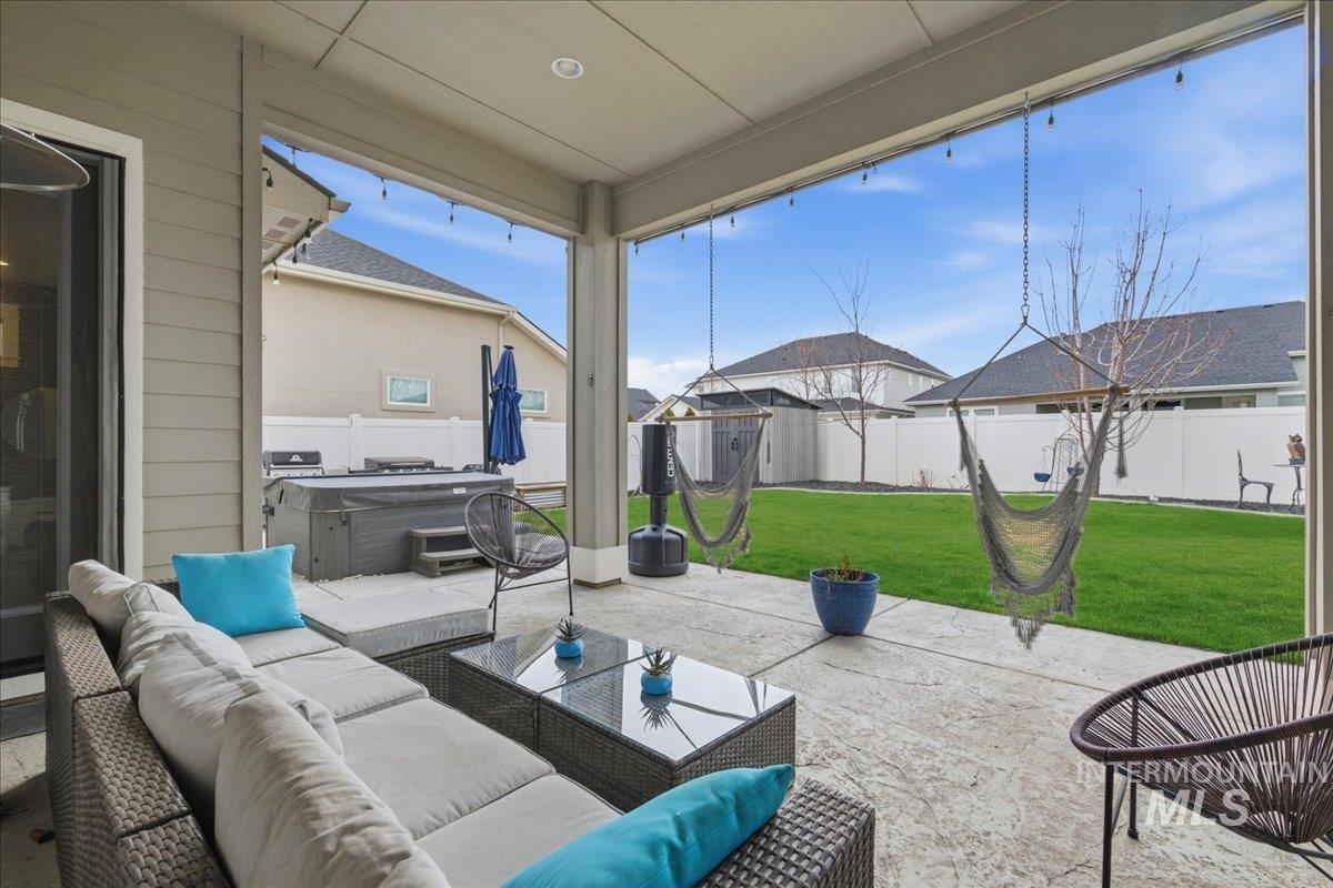 5154 South Twilight Mist Way Meridian, ID 83642 - Photo 40 of 47 Fenced backyard featuring a hot tub, a patio area, and outdoor furniture