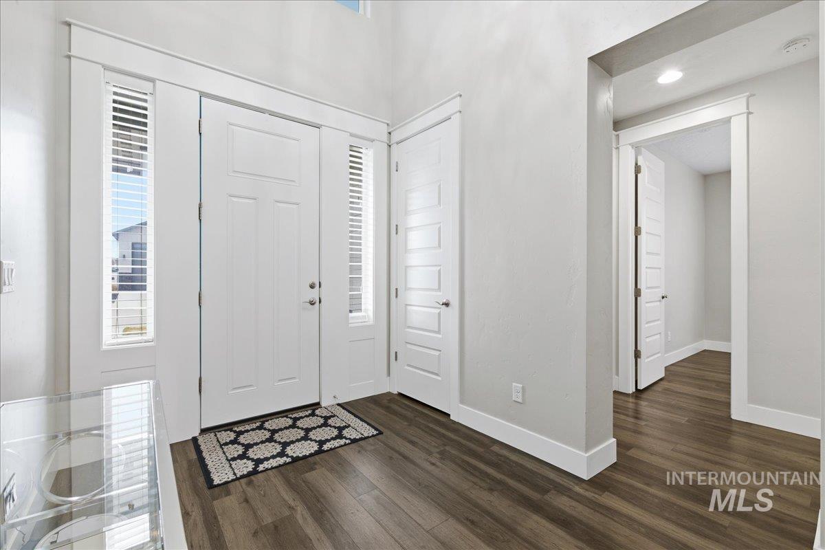 5154 South Twilight Mist Way Meridian, ID 83642 - Photo 6 of 47 Foyer featuring dark wood-style floors, plenty of natural light, and recessed lighting