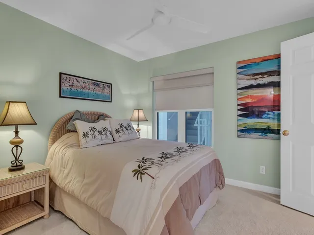 a bedroom with a bed and a lamp