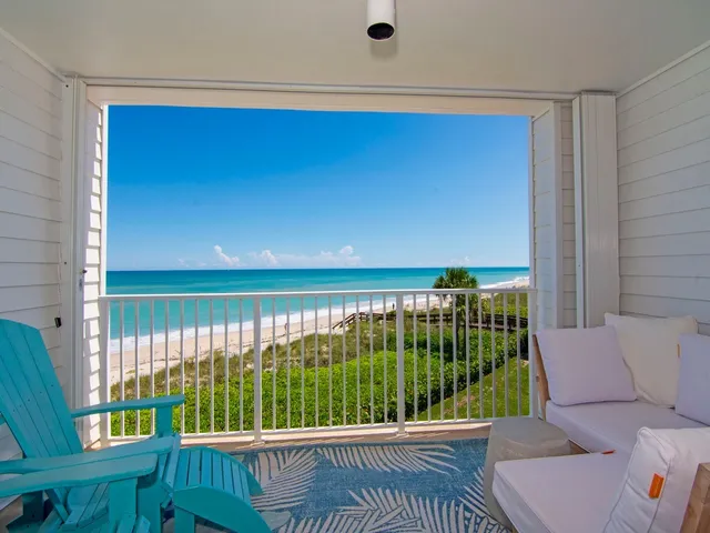 a view of a balcony with furniture