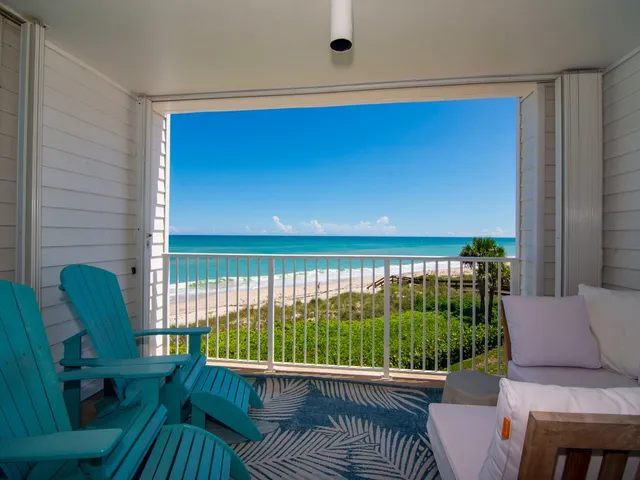 a view of a balcony with furniture